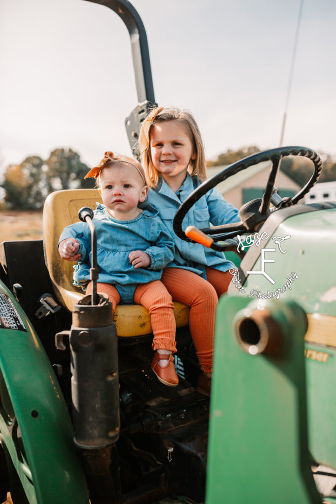 sisters on tractor