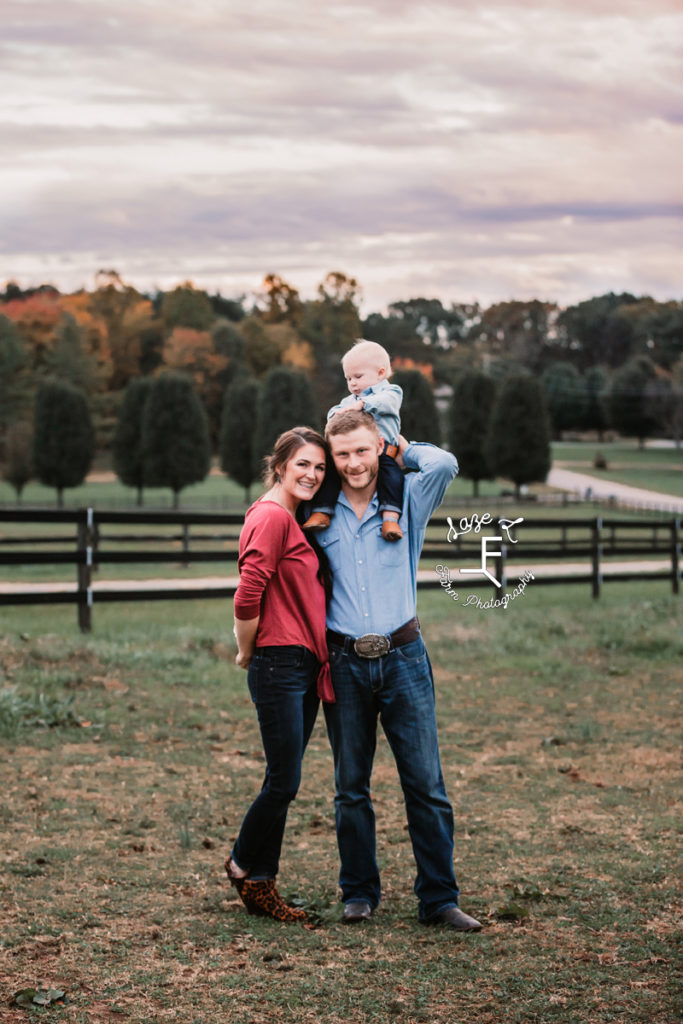 mom and dad with little one on dad's shoulders