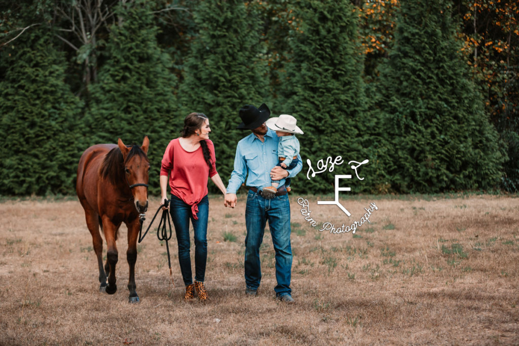 mom dad little cowboy walking wit horse