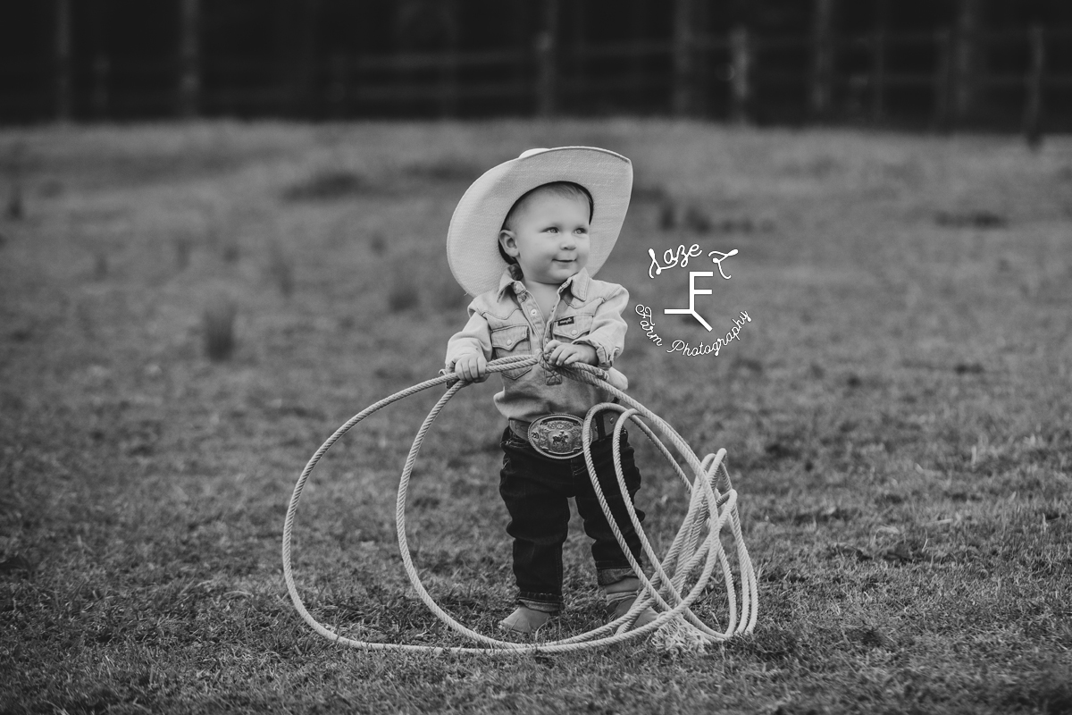 little cowboy with rope in black and white