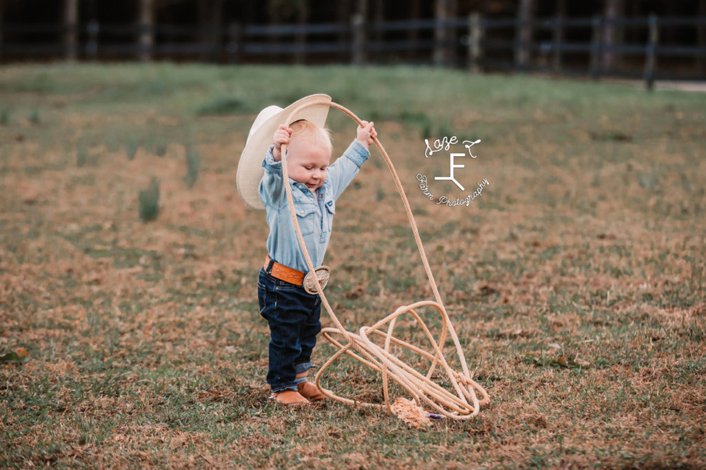 little cowboy knocking hat off with his rope
