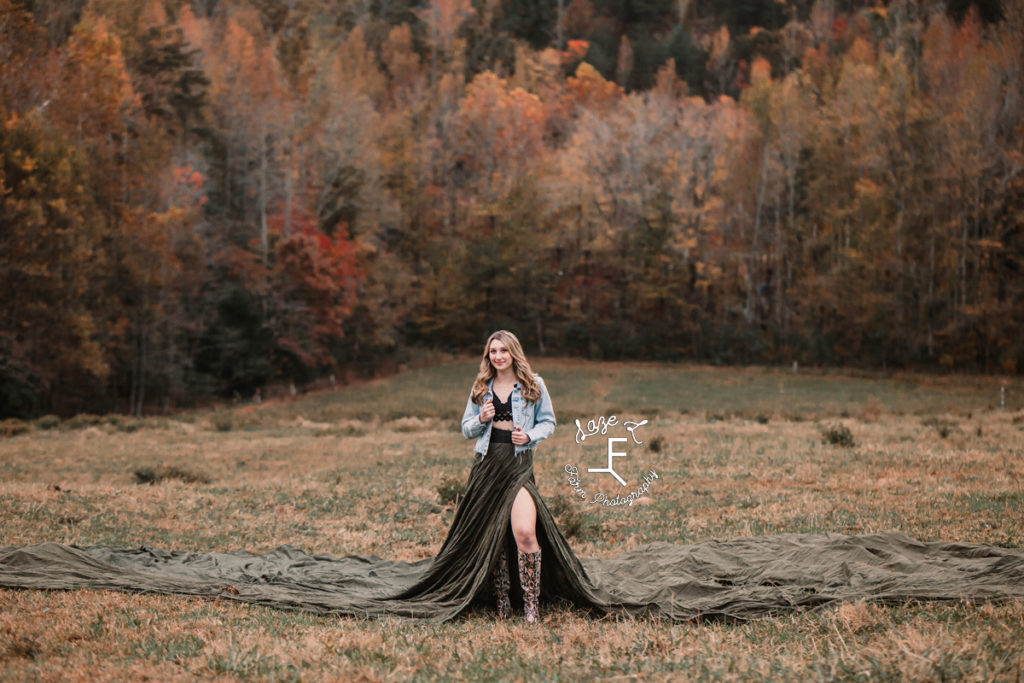 senior girl in blue jean jacket and parachute dress