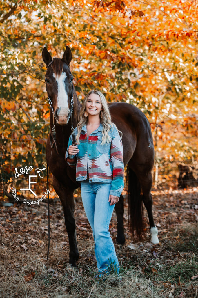 lady in Aztec print jacket with horse