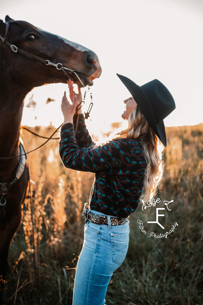 cowgirl loving horse