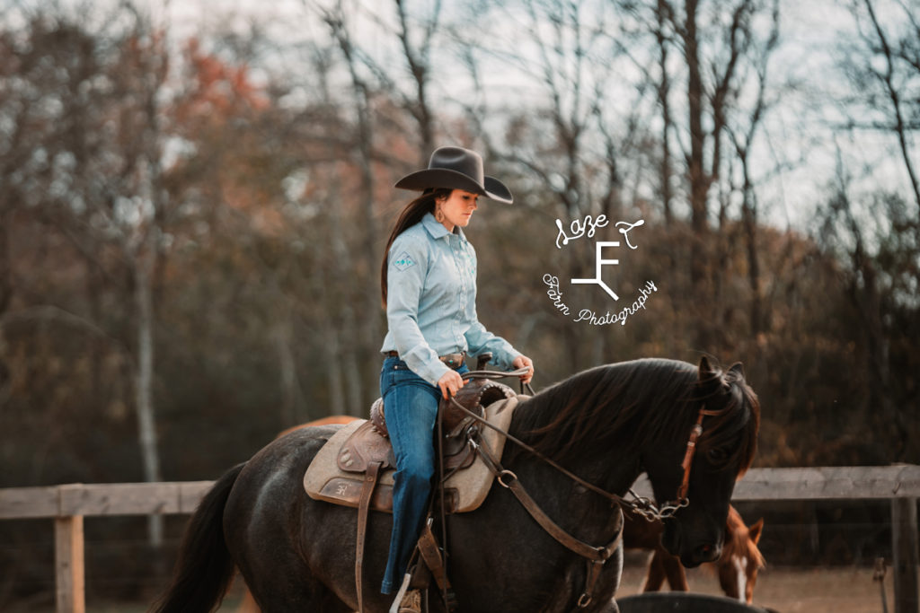 cow girl on blue roan horse