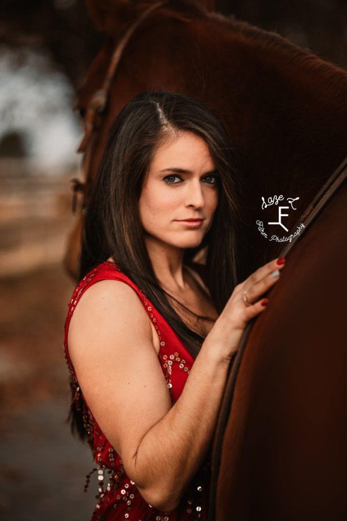 brunette in red dress with horse