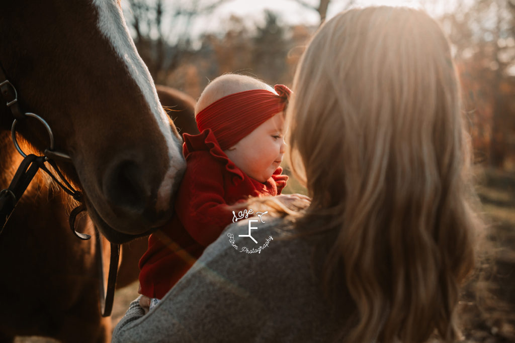 baby with horse and mom