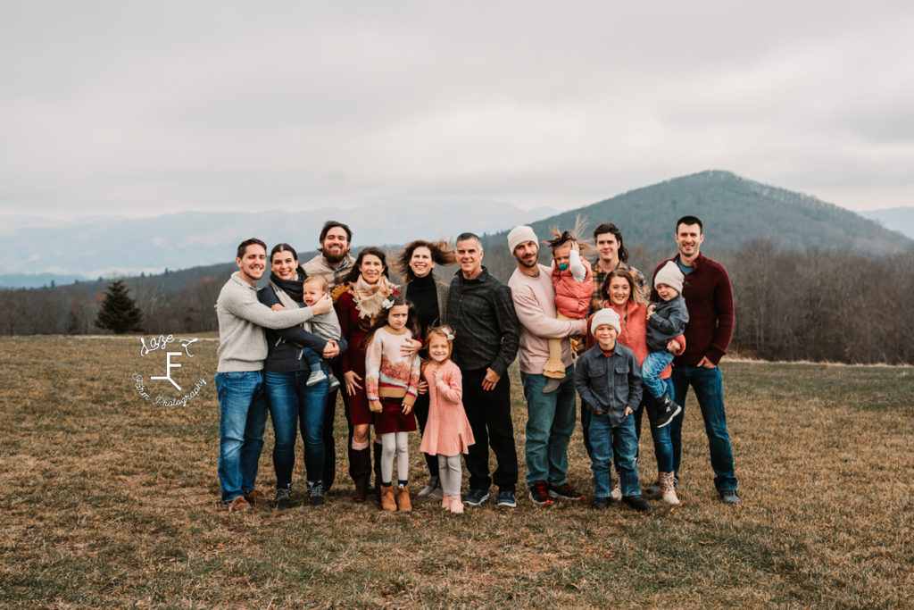large family in front of a mountain