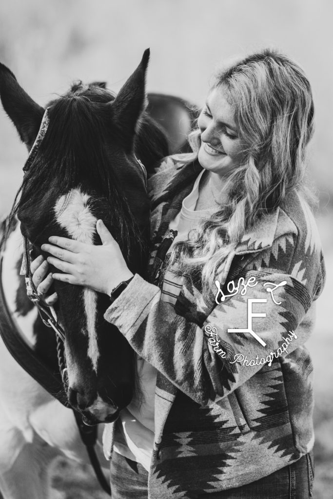 blond girl with paint horse in black and white
