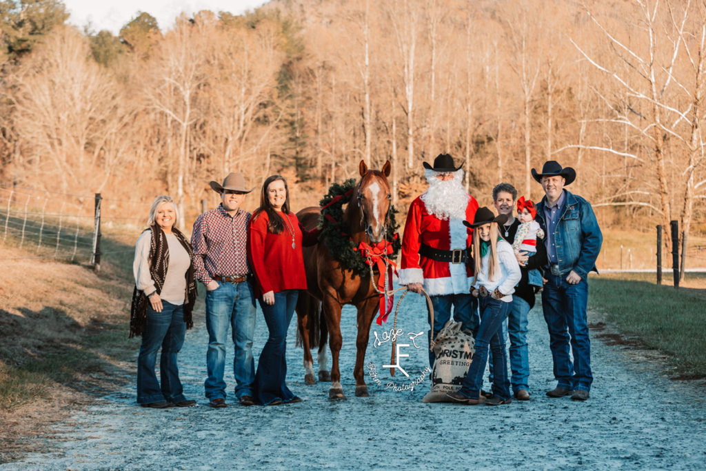 Family and friends with horse and santa