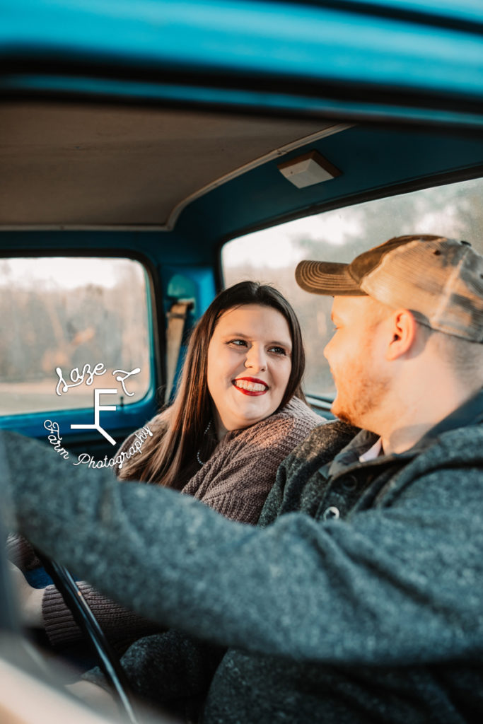 couple looking at each other in truck
