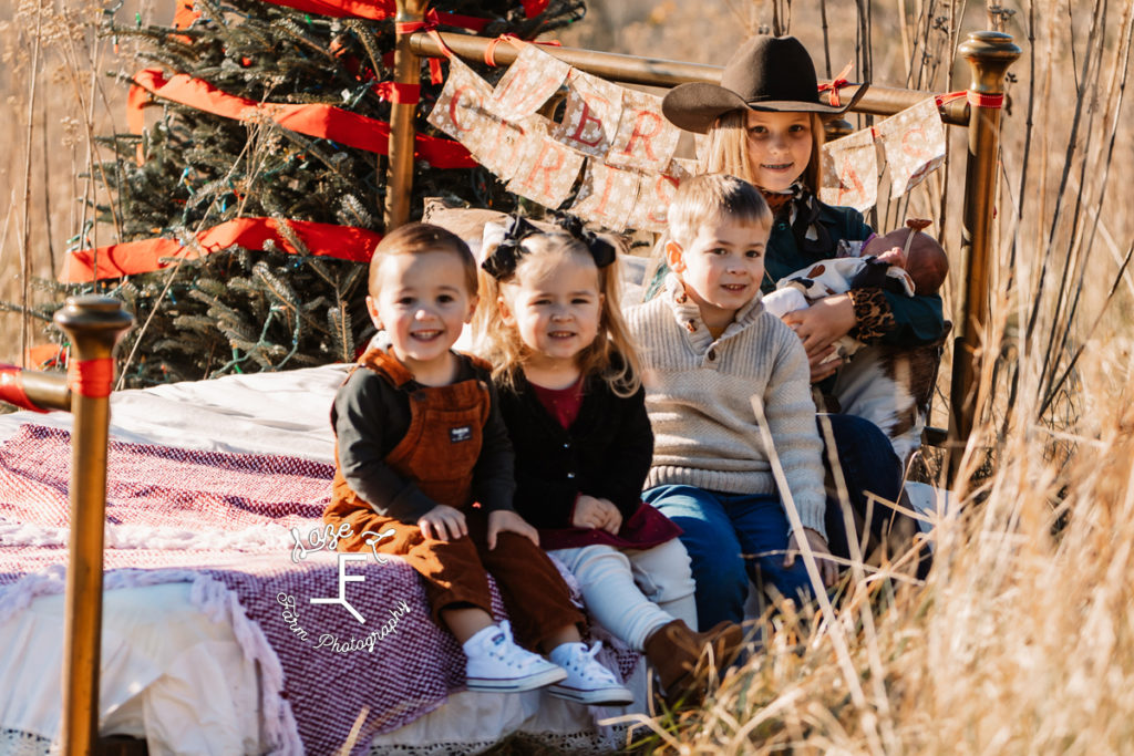 All kids on Christmas Bed