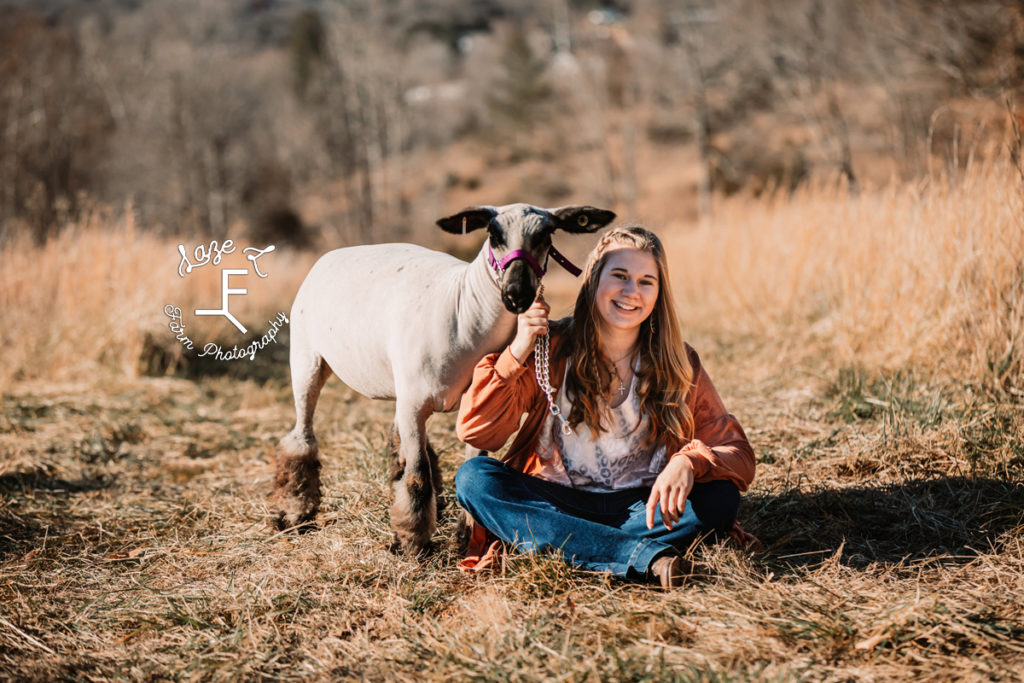 sister 2 with show lamb sitting