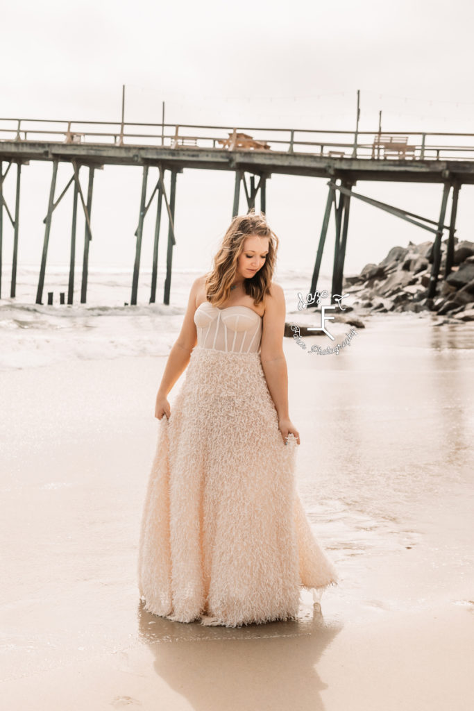 girl in beige dress on beach