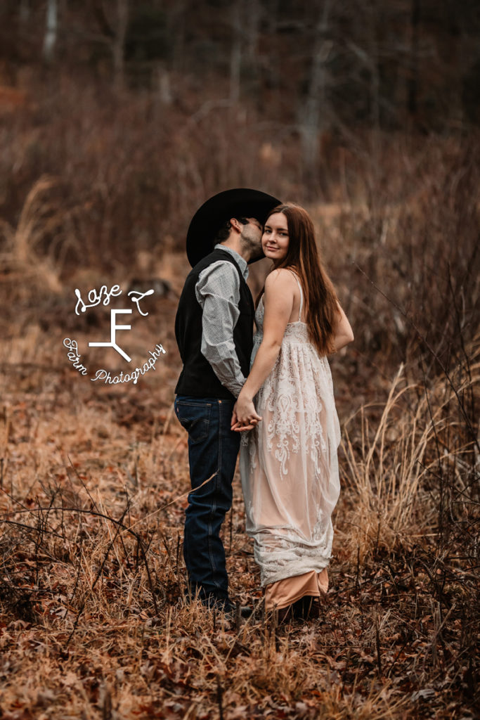 cowboy with girl in white dress