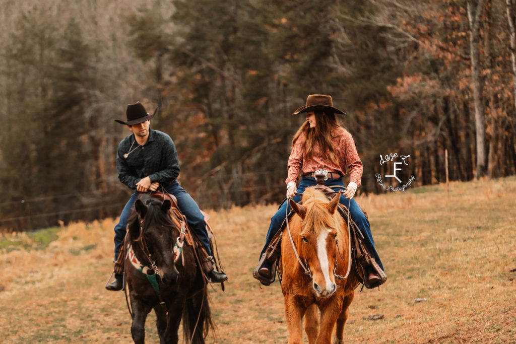 cowboy couple riding horses