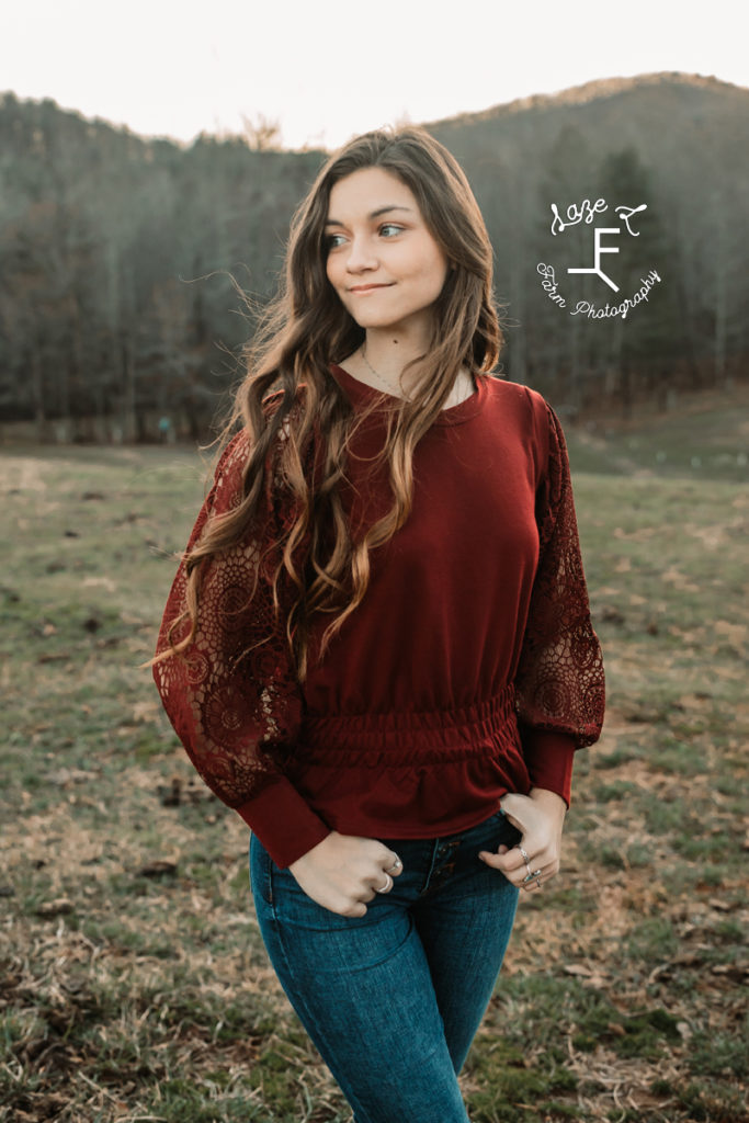 long haired girl in burgundy shirt