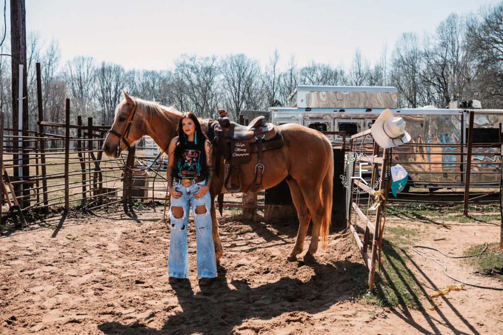 punchy cowgirl with horse