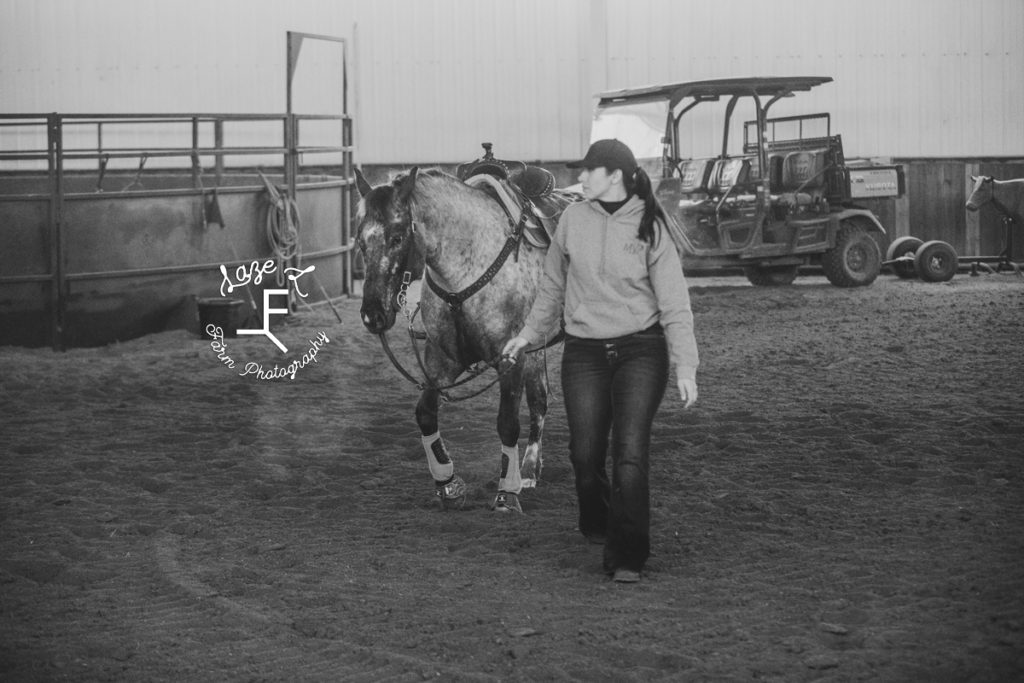 barrel racer with appaloosa in black and white