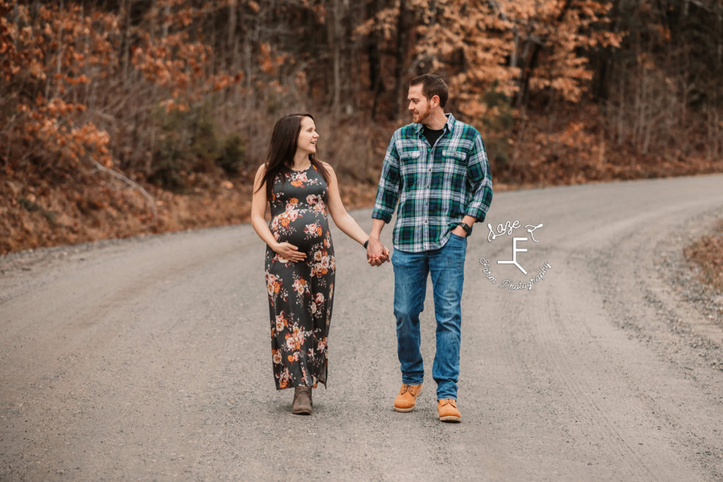 pregnant mom and husband walking