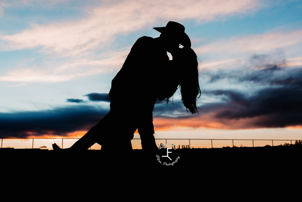 western couple silhouette at sunset