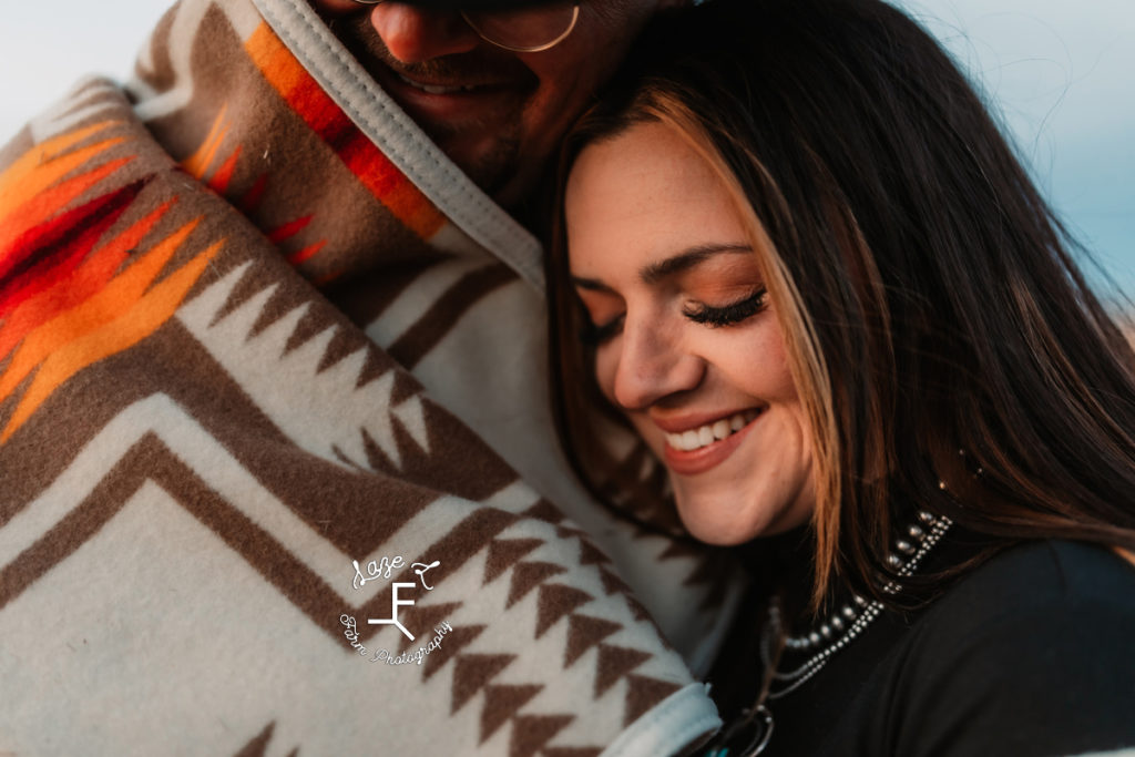 western couple wrapped in blanket together close up