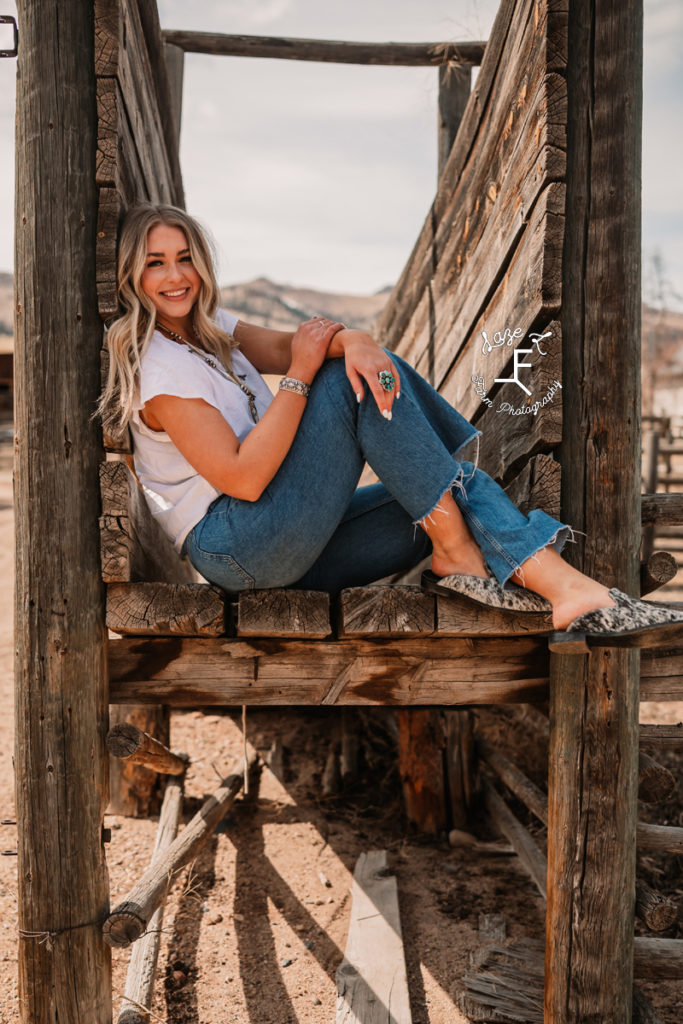 blonde model sitting on wood slats