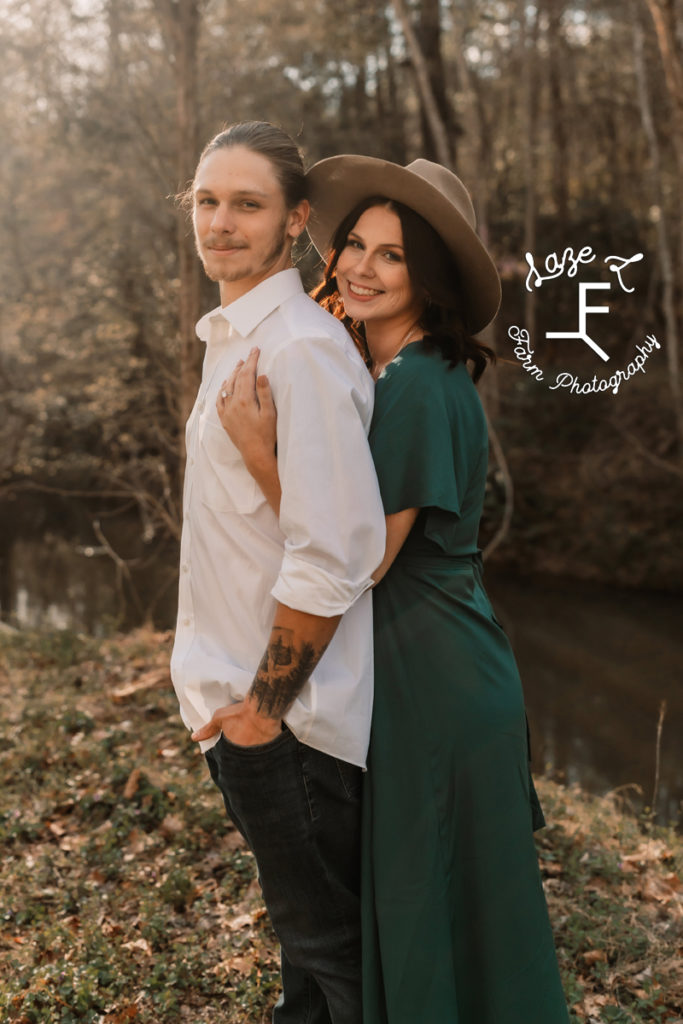 girl and guy standing together looking at the camera