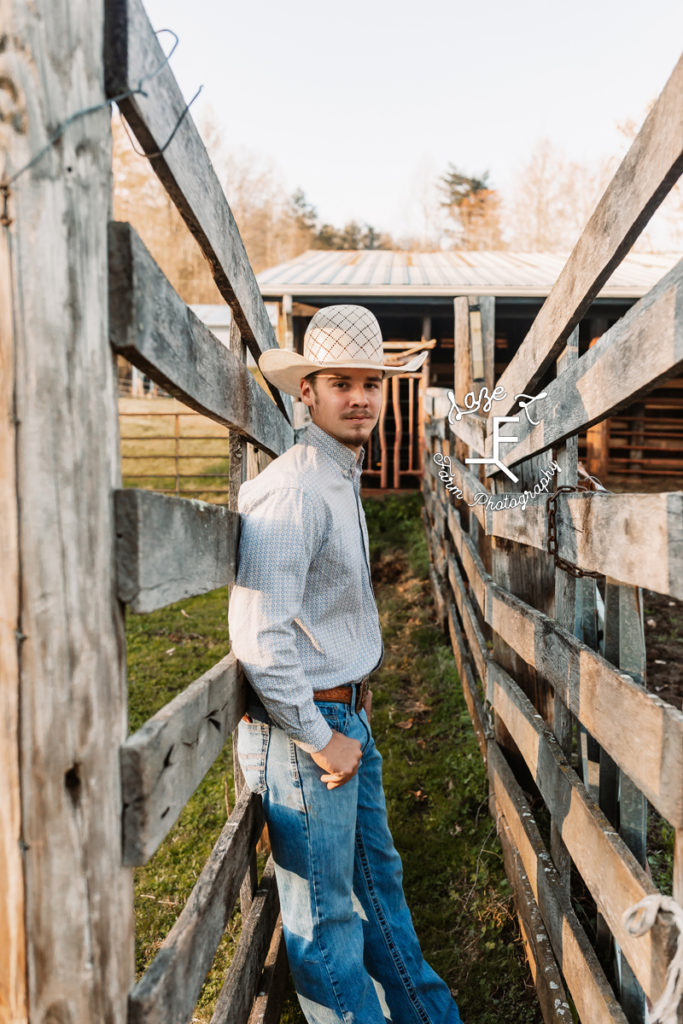 senior guy in stockyard fence