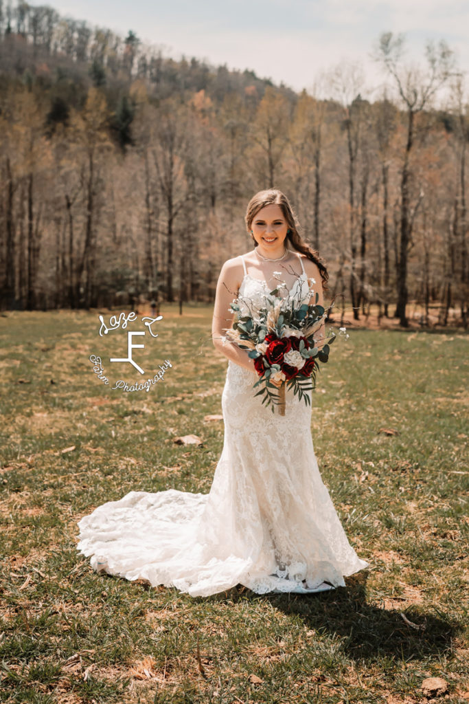 Bride holding flowers smiling