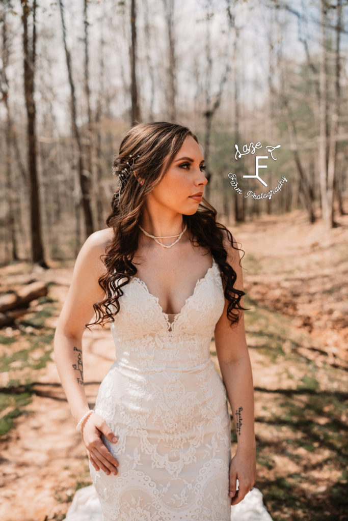 close up of bride in the woods looking right