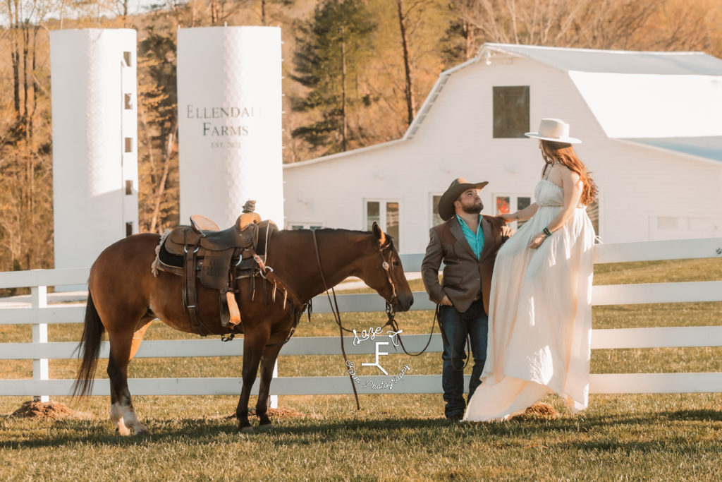 cowboy couple in front of venue