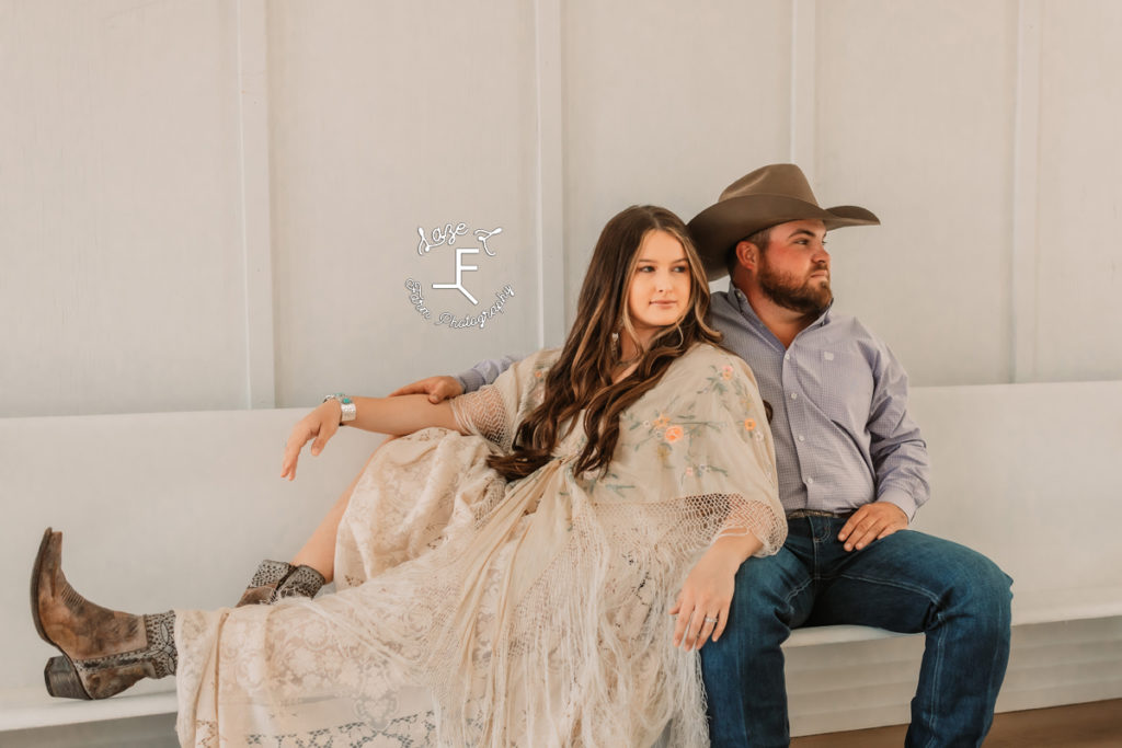 western couple sitting on white church pew