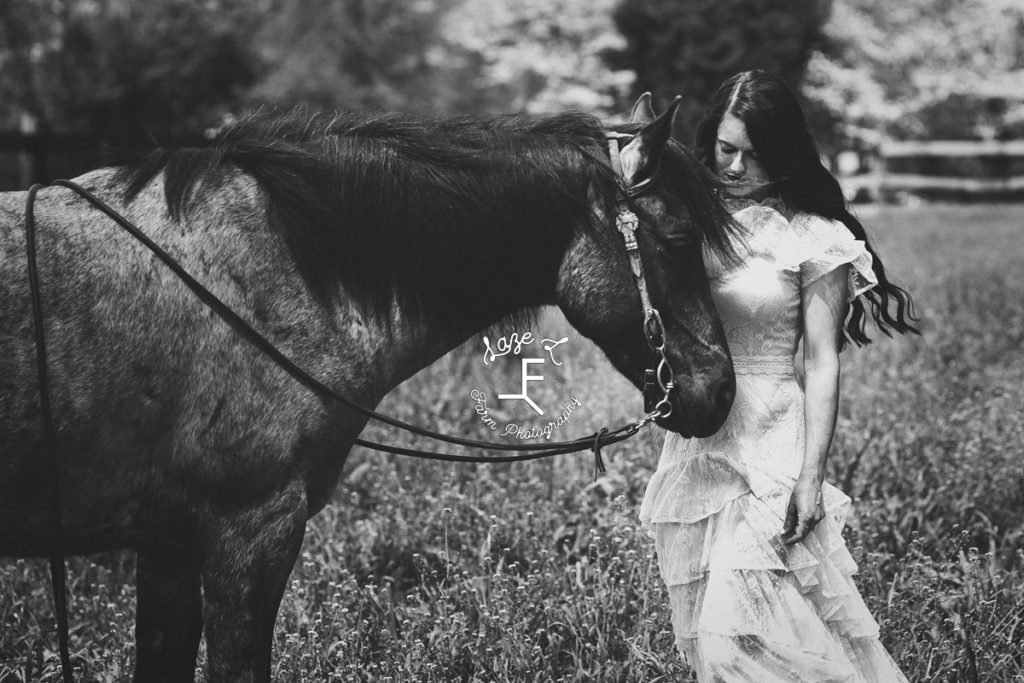 vintage cowgirl with horse in black and white