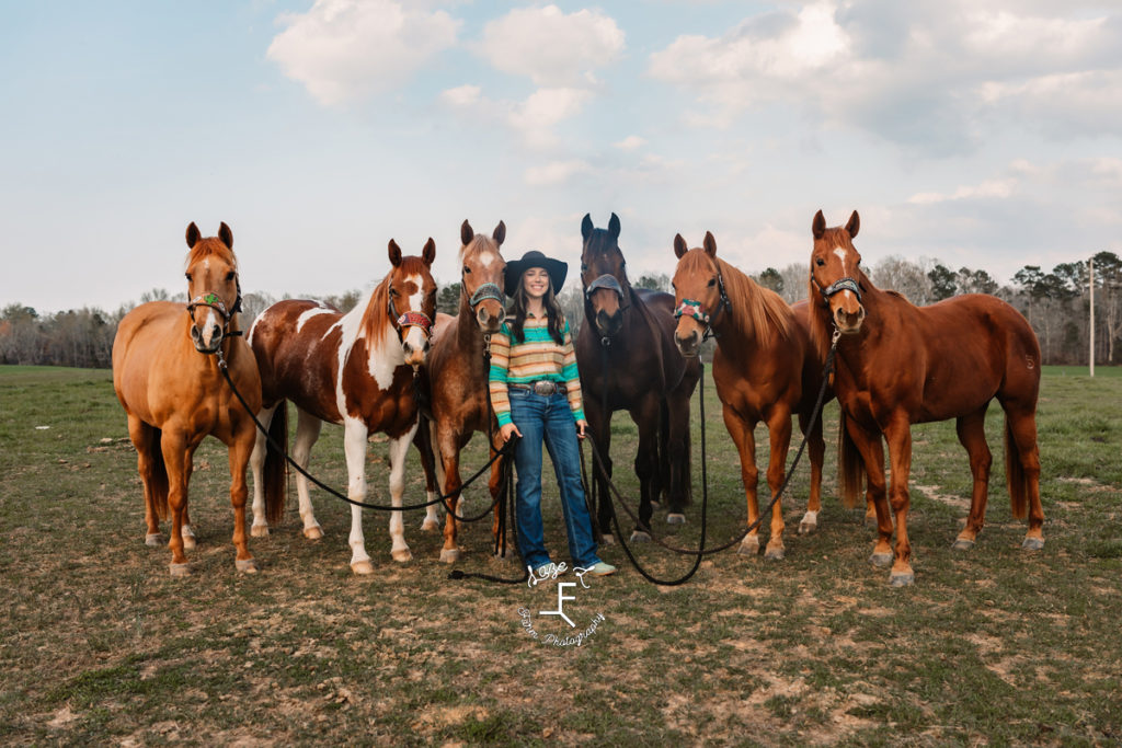 cowgirl with 6 horses