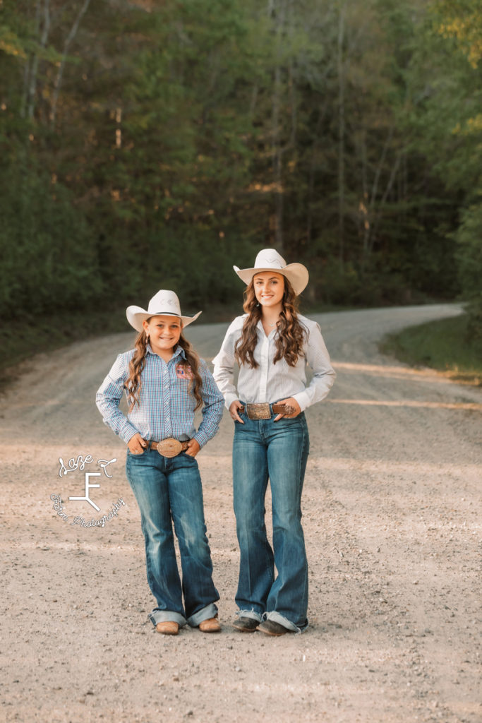 cowgirl sisters on dirt road