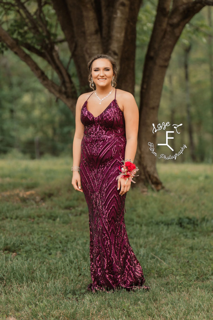 high school girl in purple prom dress