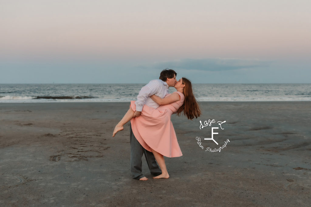 couple kissing on the beach