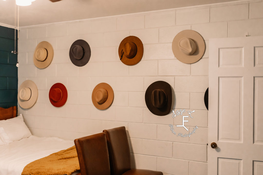 hats hanging on the wall 