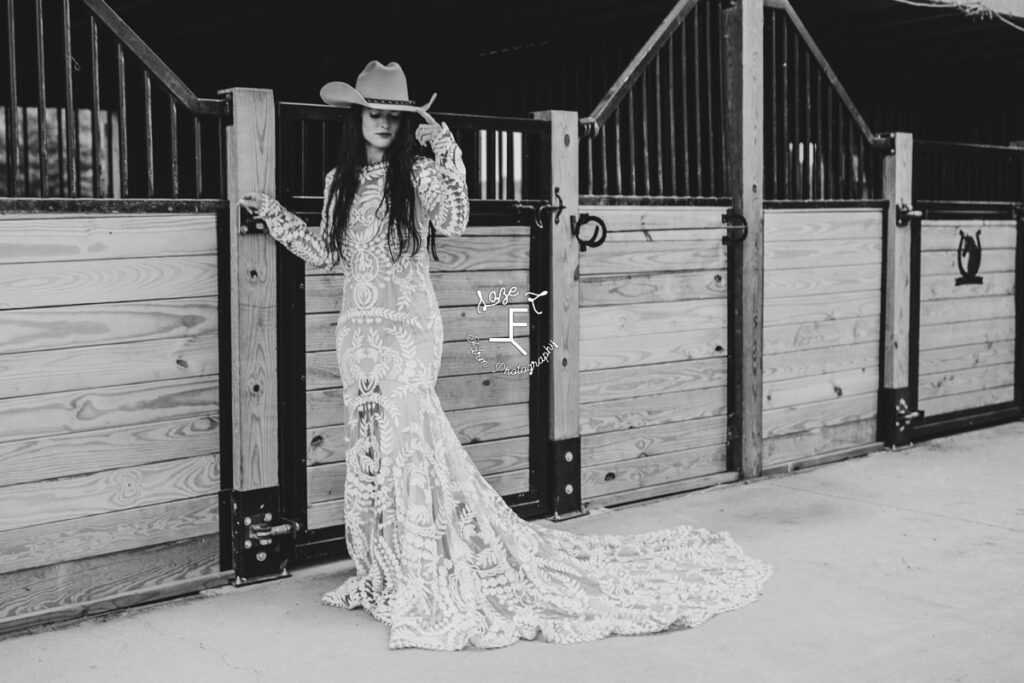 cowgirl in lace wedding dress in black and white