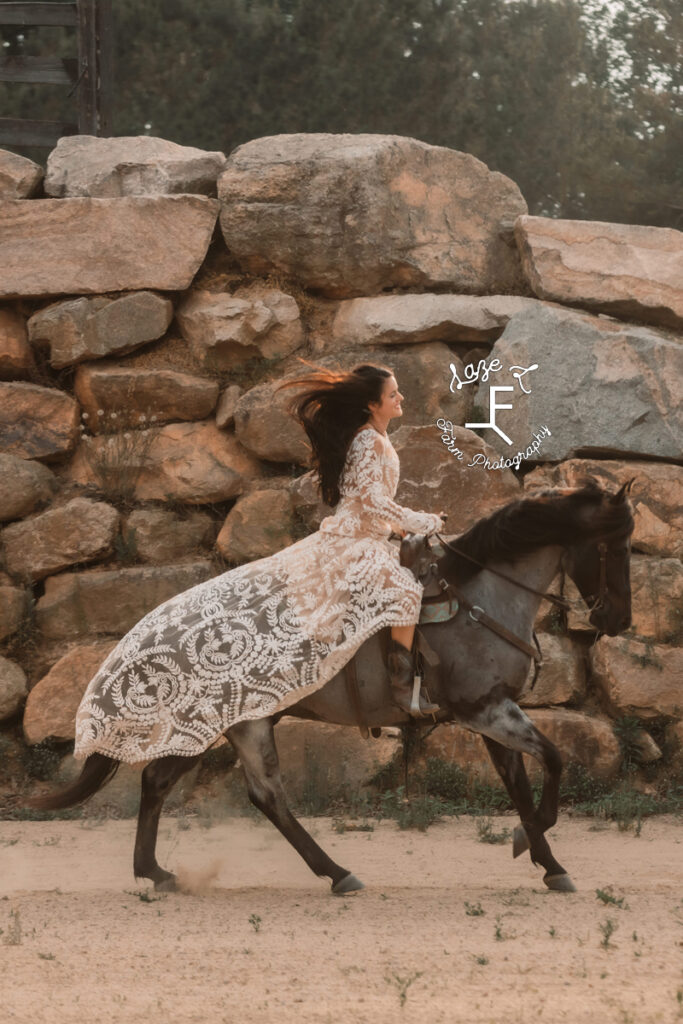 woman riding horse in lace wedding dress