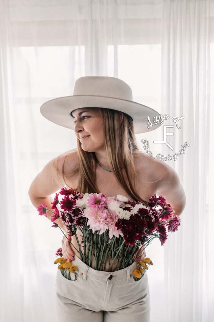 cowgirl at the window with flower pants