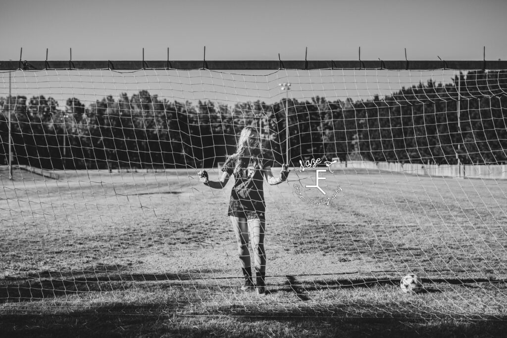 senior soccer player in black and white