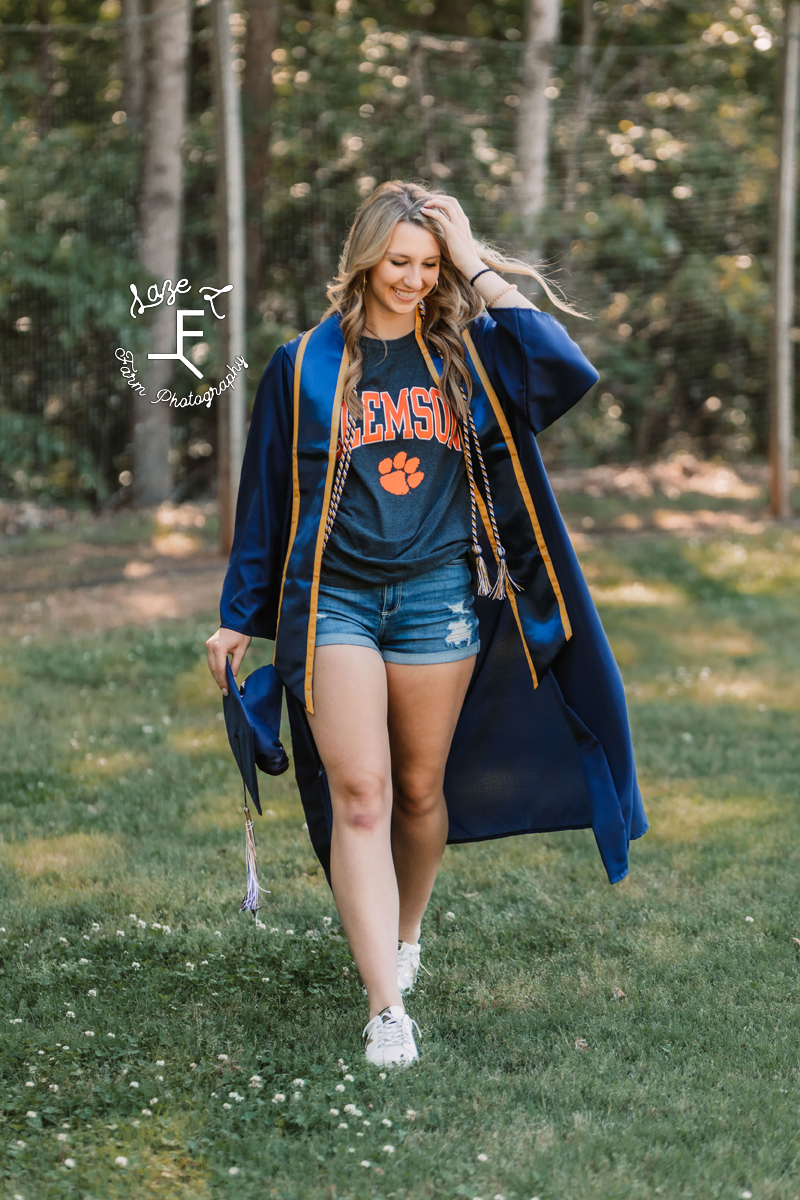 senior girl with Clemson shirt in cap and gown