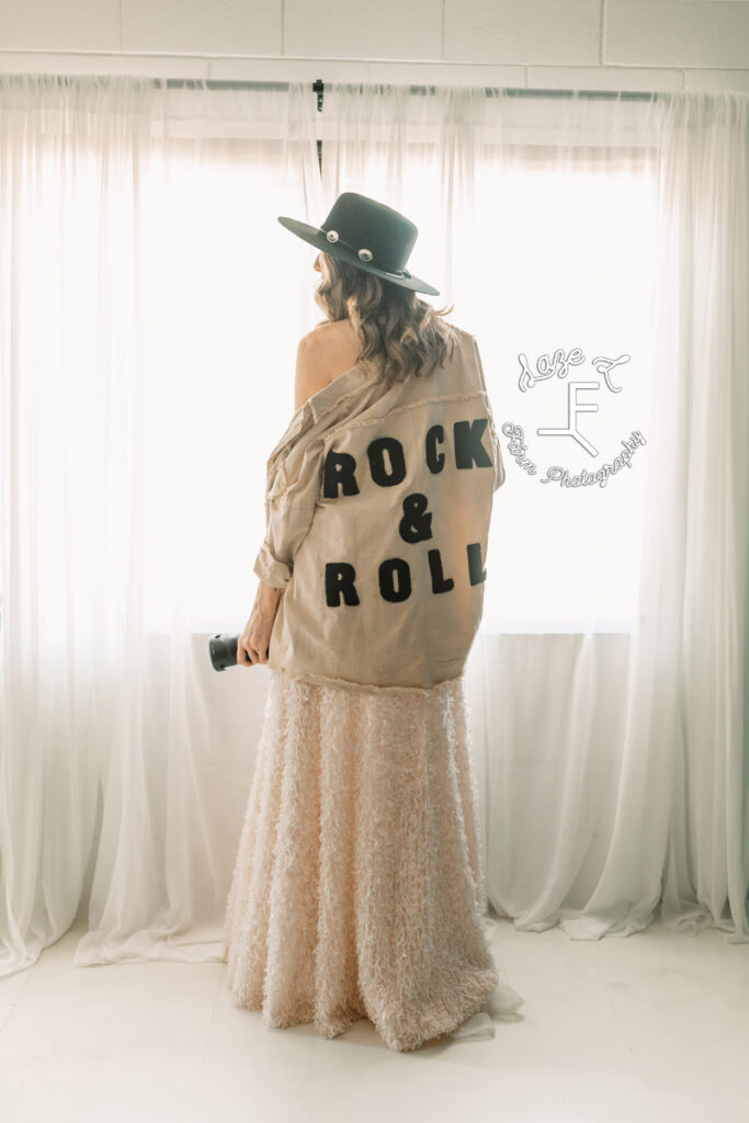 jess in white dress with rock and roll jacket