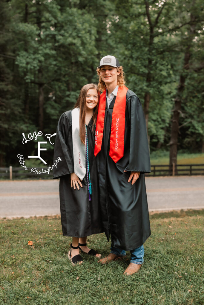 senior couple in grad gowns