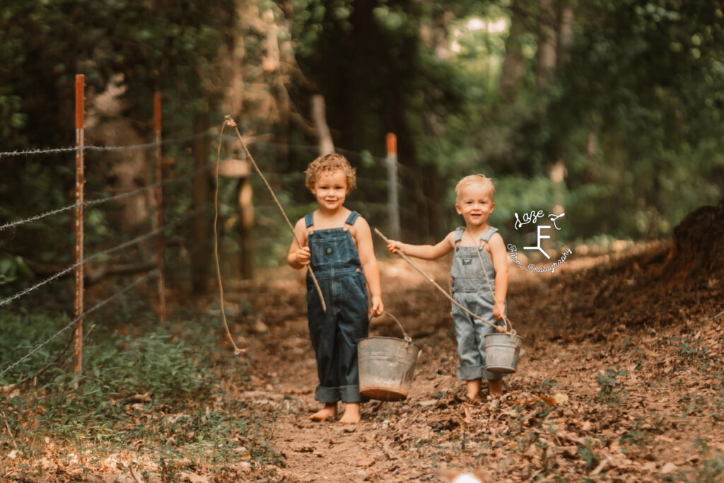 brothers in overalls with homemade fishing poles