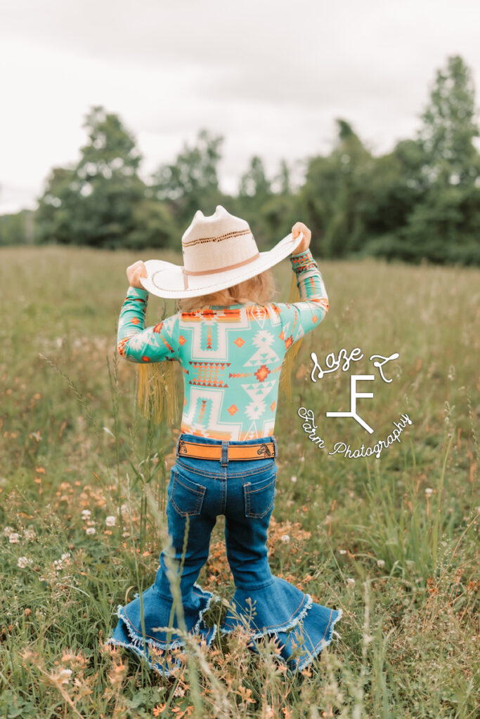 little cowgirl walking away