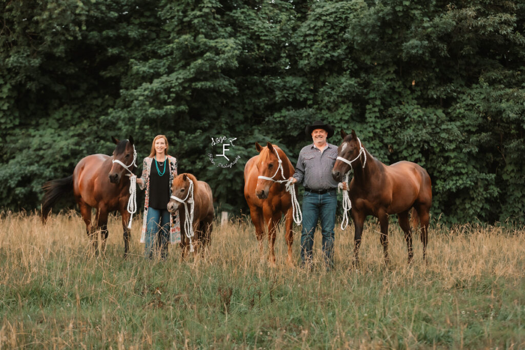 mom and dad with 4 horses