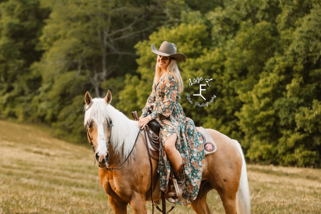 cowgirl sitting on palomino